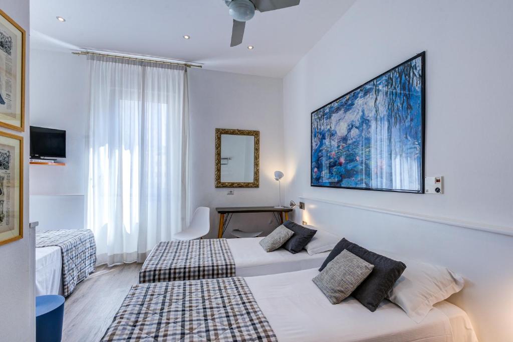 Postel nebo postele na pokoji v ubytování Hotel Bernina