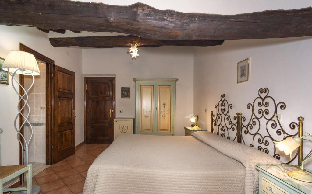 Postel nebo postele na pokoji v ubytování Hotel Villa Cheli