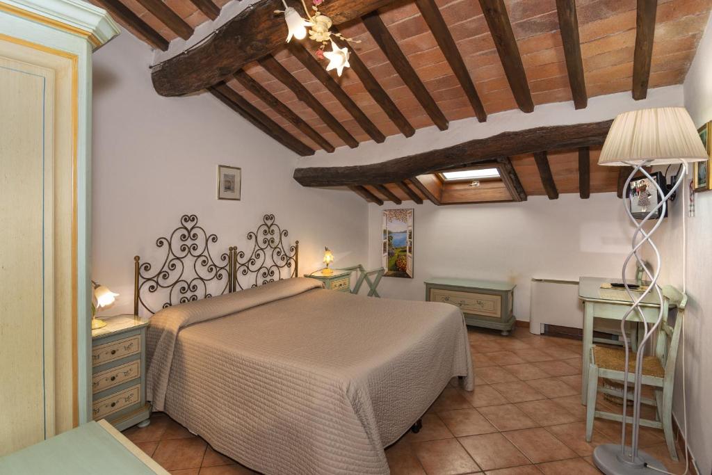 Postel nebo postele na pokoji v ubytování Hotel Villa Cheli