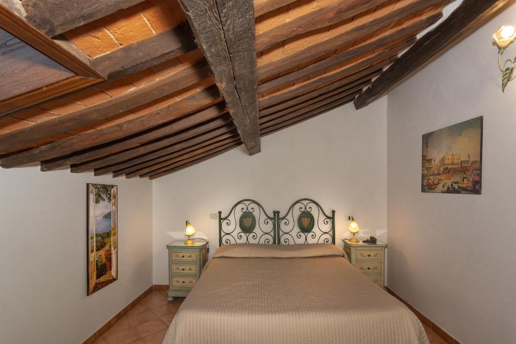 Postel nebo postele na pokoji v ubytování Hotel Villa Cheli