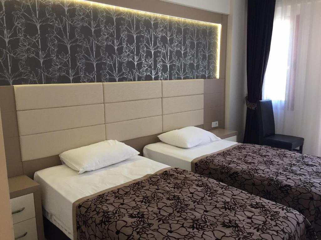 Postel nebo postele na pokoji v ubytování Mendos Garden Exclusive Hotel Fethiye