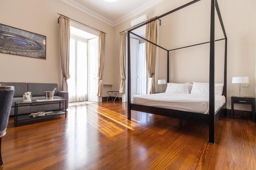 A bed or beds in a room at Gramsci Suites