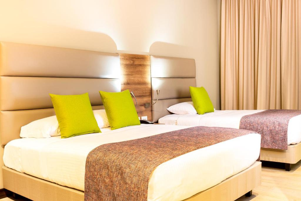 Postel nebo postele na pokoji v ubytování Hotel F25