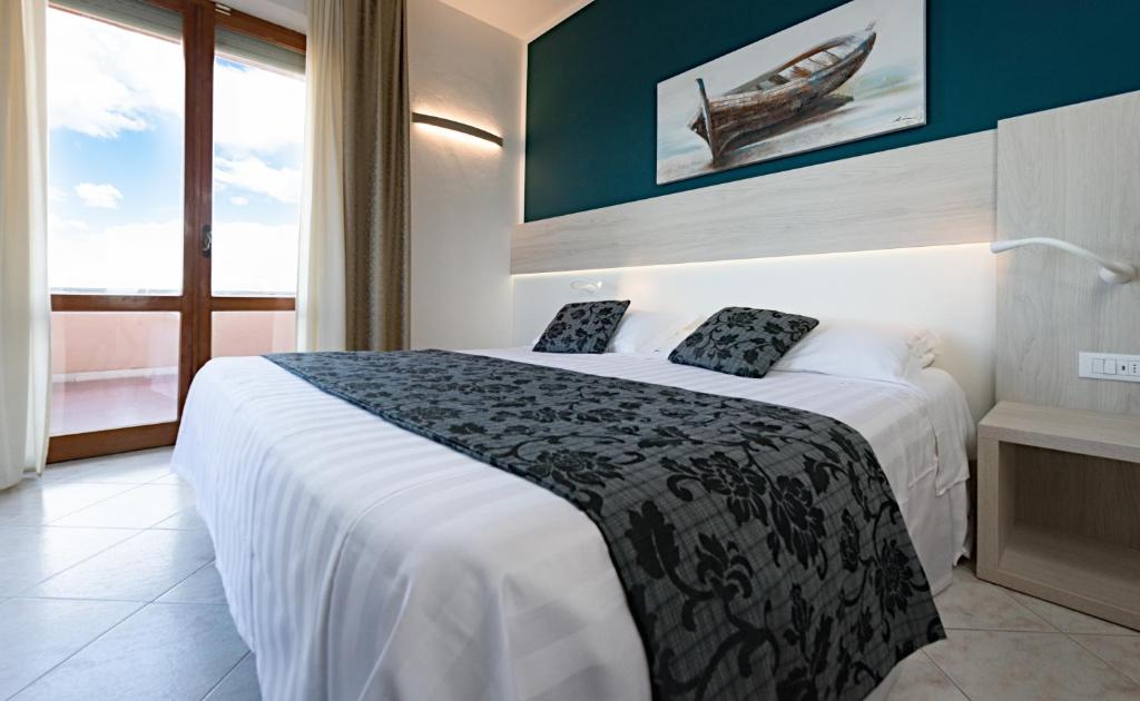 Posteľ alebo postele v izbe v ubytovaní Hotel il Delfino