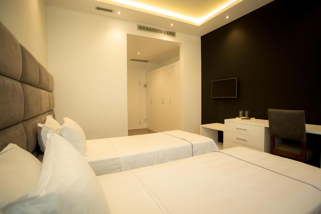 Postel nebo postele na pokoji v ubytování Havana Hotel