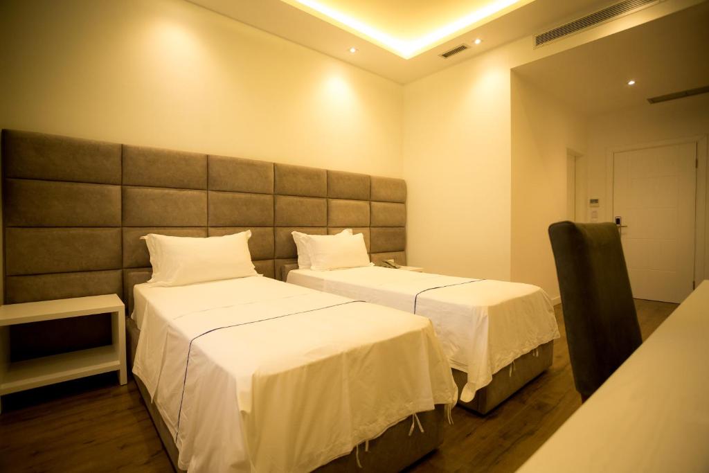 Postel nebo postele na pokoji v ubytování Havana Hotel