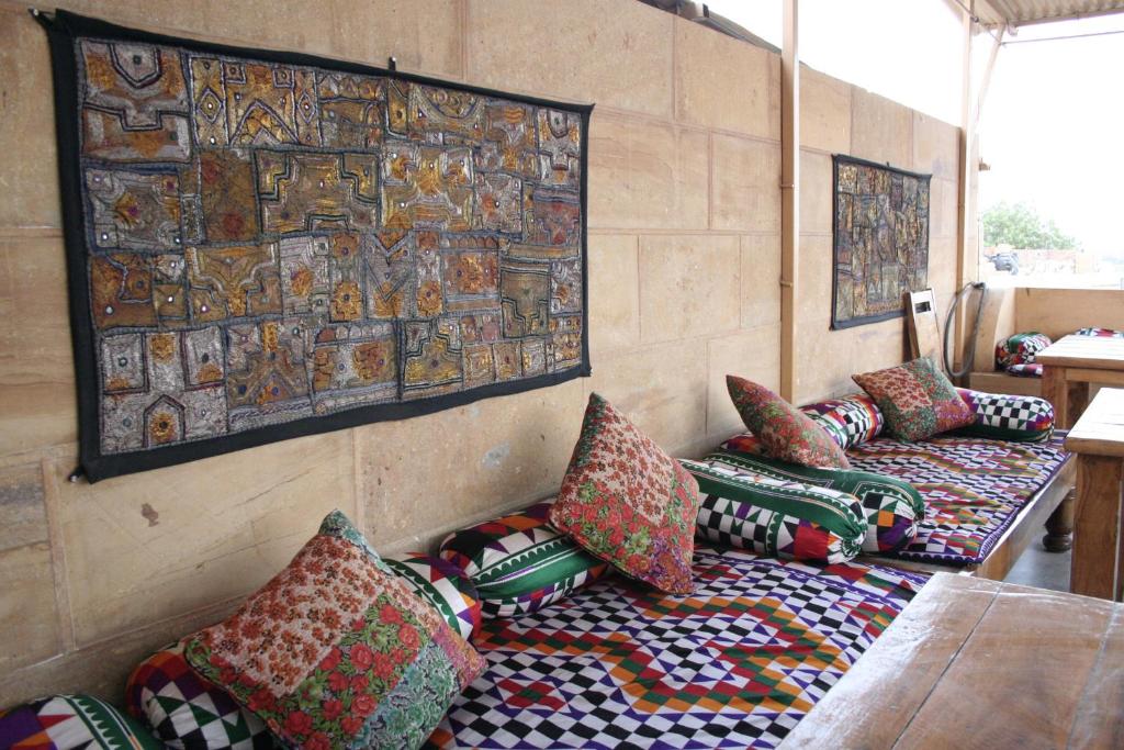 a room with couches and pillows in a room at Shanti Home in Jaisalmer