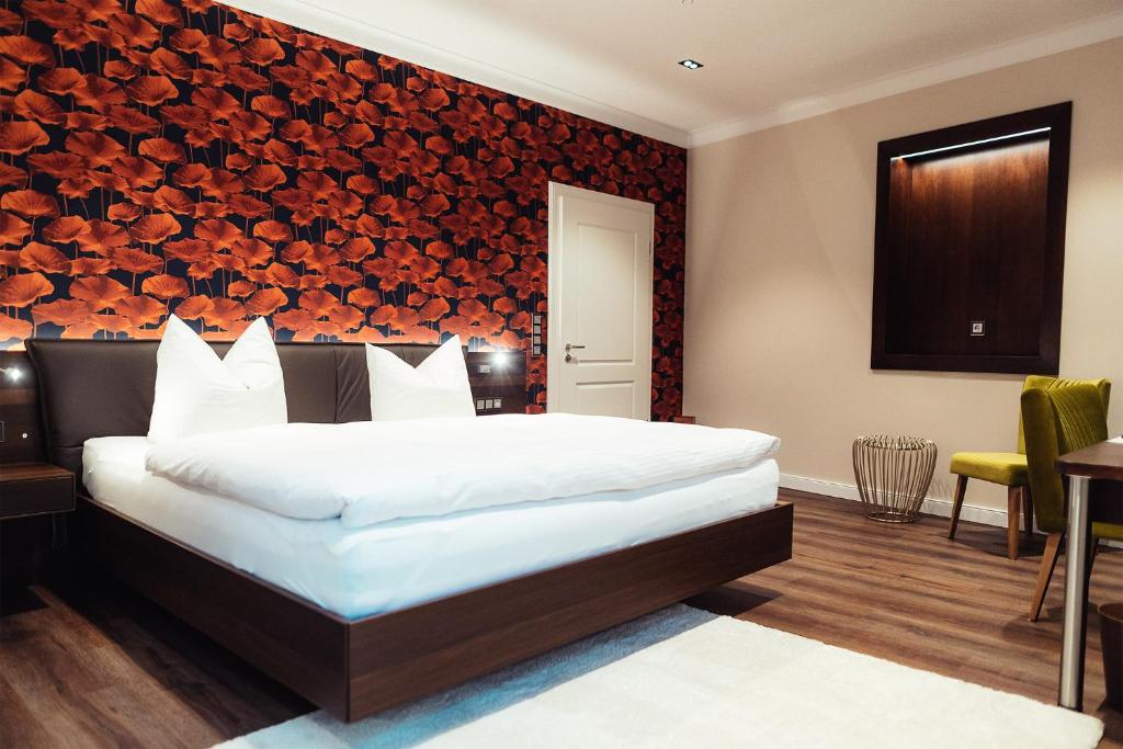 Postel nebo postele na pokoji v ubytování Hotel - Pension & Gaststätte "Alter König"