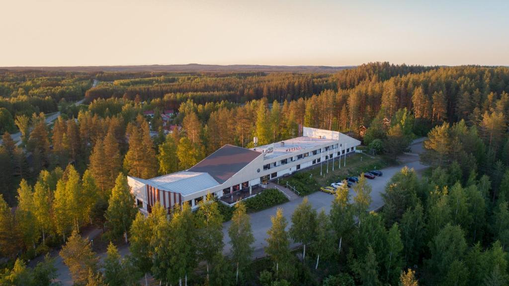 an aerial view of a building in the middle of a river at Hotel Julie in Joensuu