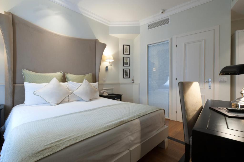 Postel nebo postele na pokoji v ubytování Hotel Bologna ***S