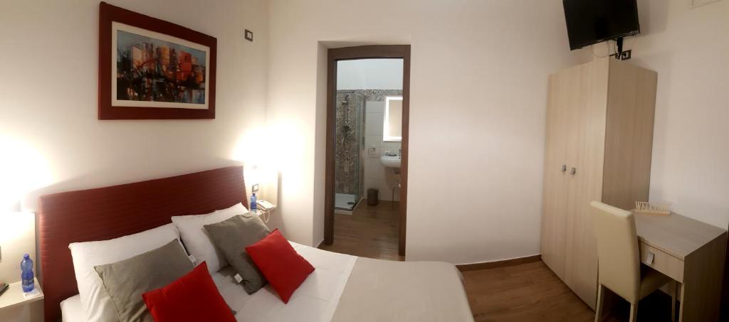 Postel nebo postele na pokoji v ubytování B&B Il Campanile