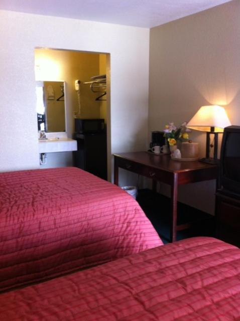 Postel nebo postele na pokoji v ubytování Gold Inn