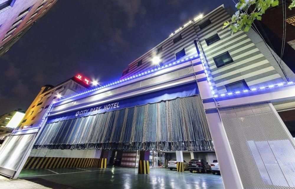 a building with lights on the front of it at City Park Hotel in Seoul