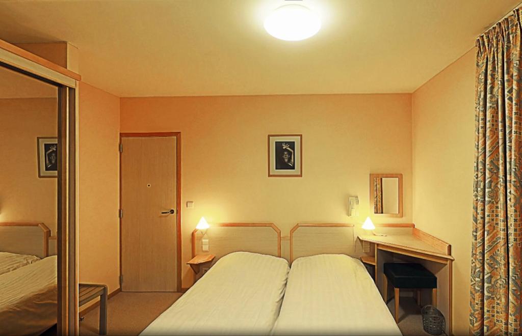 Postel nebo postele na pokoji v ubytování Familiehotel Soll Cress Koksijde