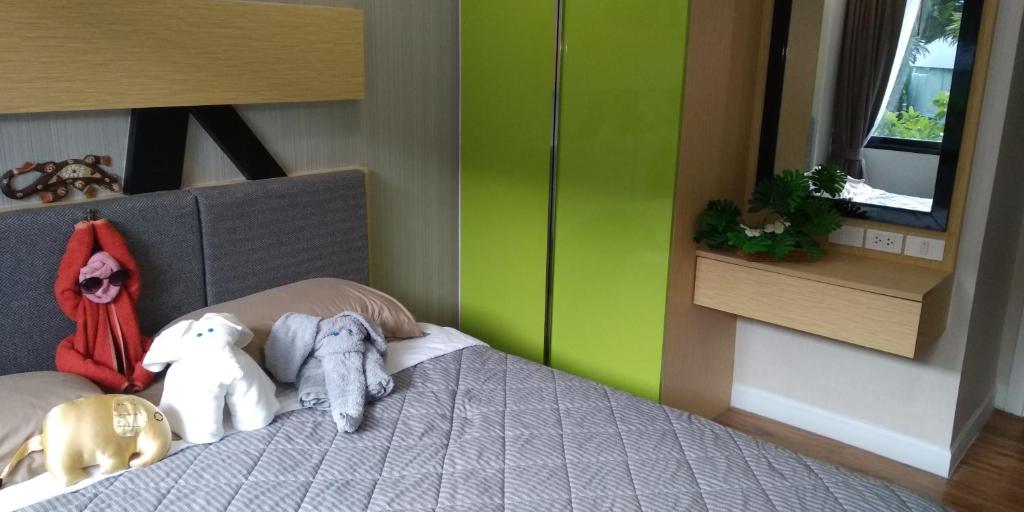 Postel nebo postele na pokoji v ubytování Dusit Grand Park Condo
