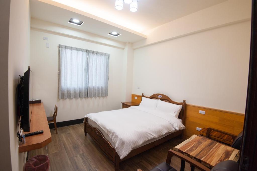 Postel nebo postele na pokoji v ubytování Habitat Heart B&B