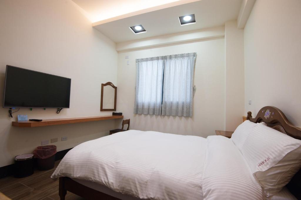 Postel nebo postele na pokoji v ubytování Habitat Heart B&B