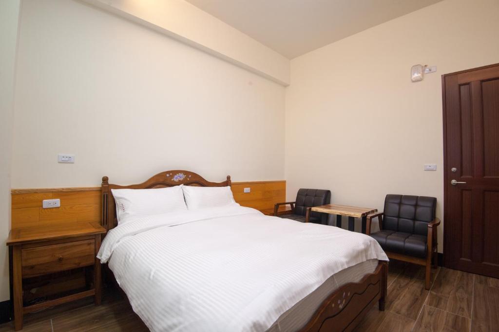 Postel nebo postele na pokoji v ubytování Habitat Heart B&B