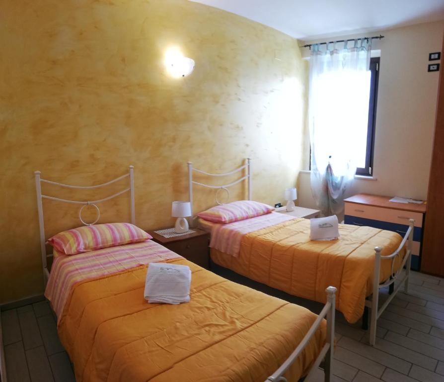 Postel nebo postele na pokoji v ubytování La Bella Addormentata