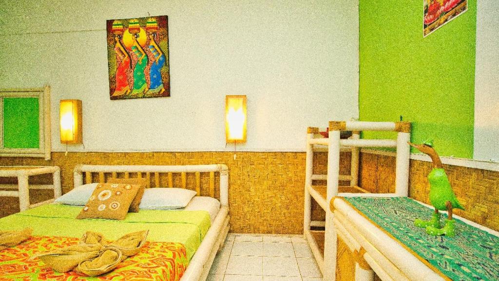 Postel nebo postele na pokoji v ubytování Rumah Kundun