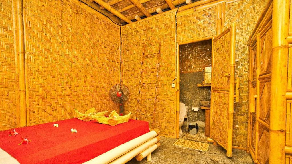 Postel nebo postele na pokoji v ubytování Rumah Kundun