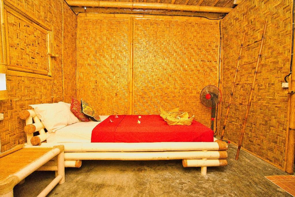 Postel nebo postele na pokoji v ubytování Rumah Kundun