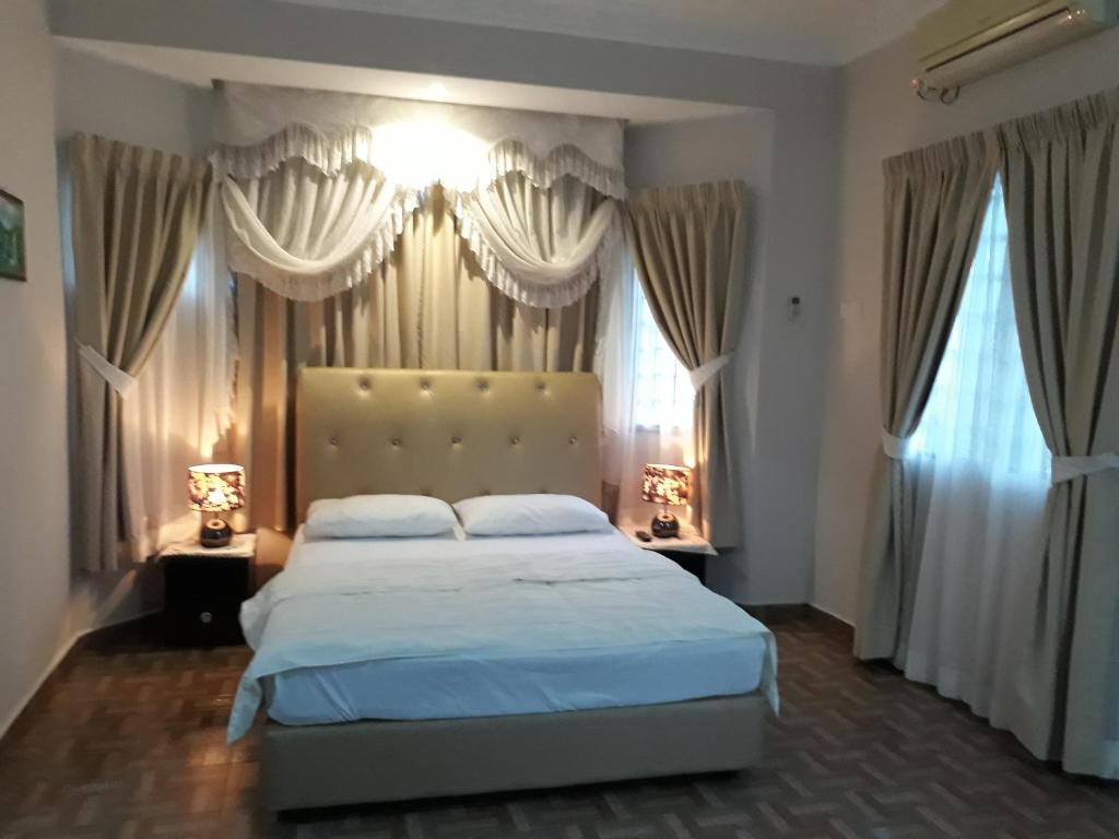 Ліжко або ліжка в номері SMART Homestay Permaipura