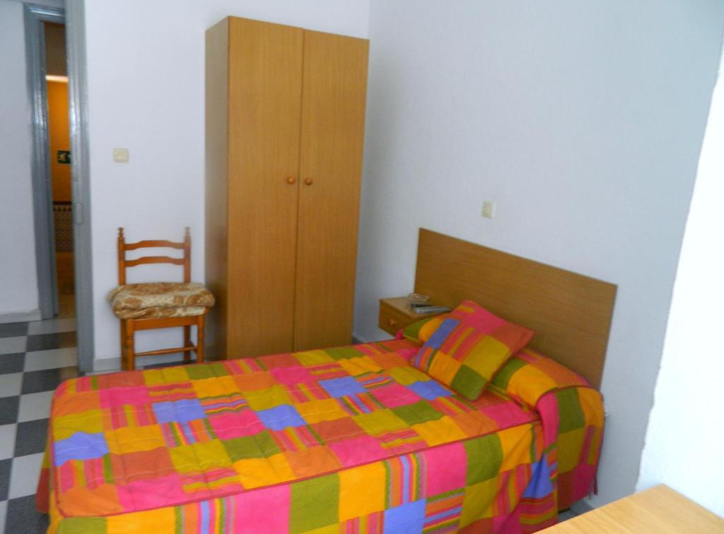 Postel nebo postele na pokoji v ubytování La Esteponera