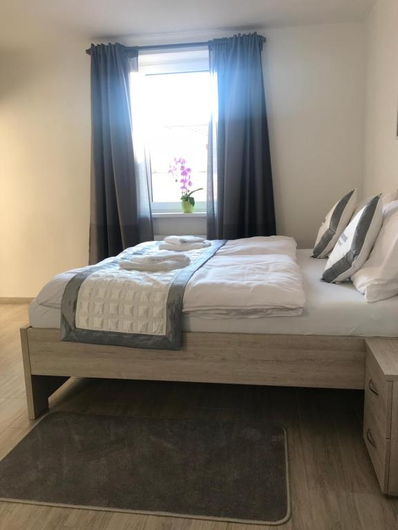 Postel nebo postele na pokoji v ubytování Panorama Apartments