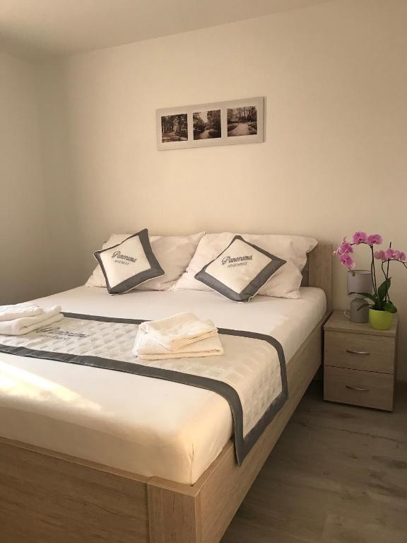 Postel nebo postele na pokoji v ubytování Panorama Apartments