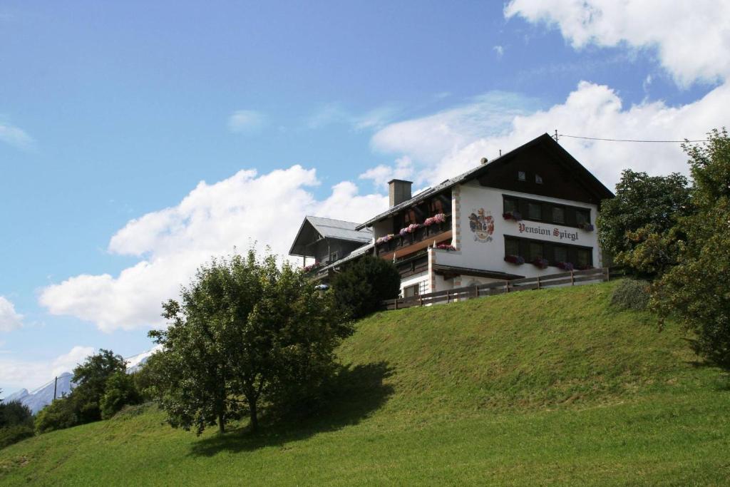 a house on the top of a hill at Pension Spiegl in Seefeld in Tirol