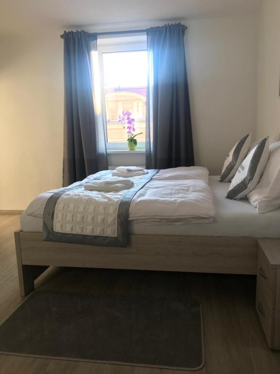 Postel nebo postele na pokoji v ubytování Panorama Apartments