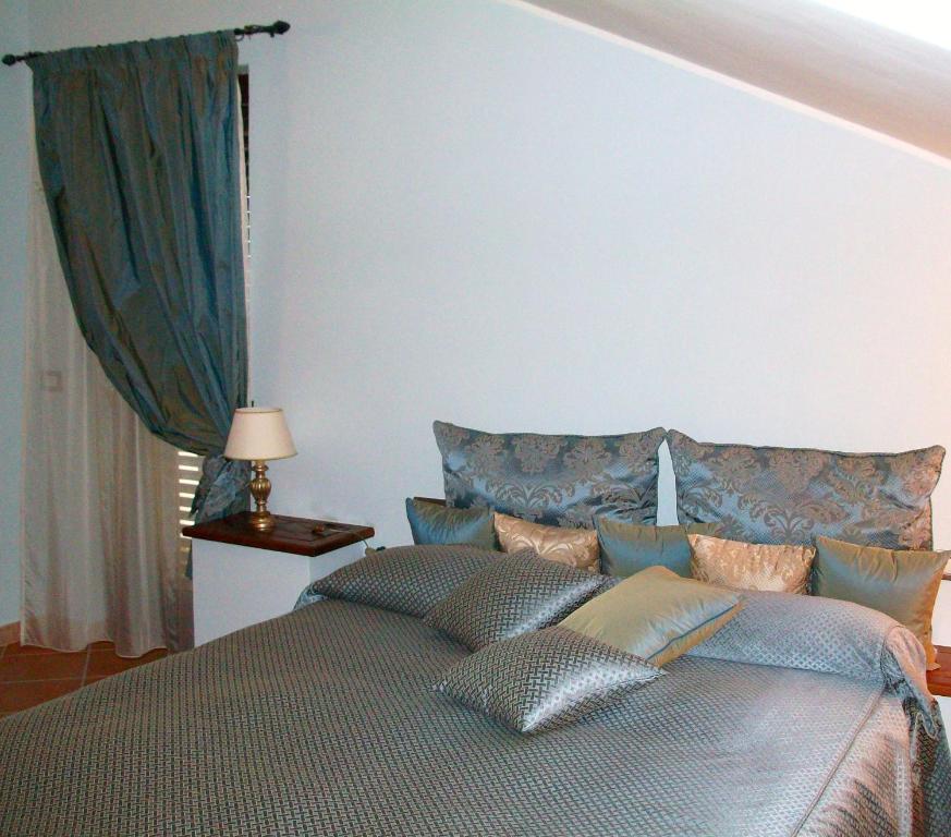 Postel nebo postele na pokoji v ubytování Residence Hotel La Commenda