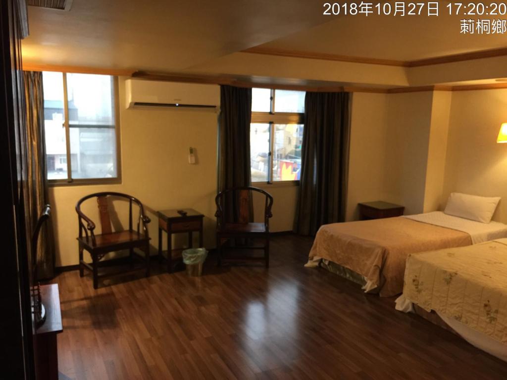 Postel nebo postele na pokoji v ubytování San Ho Business Hotel