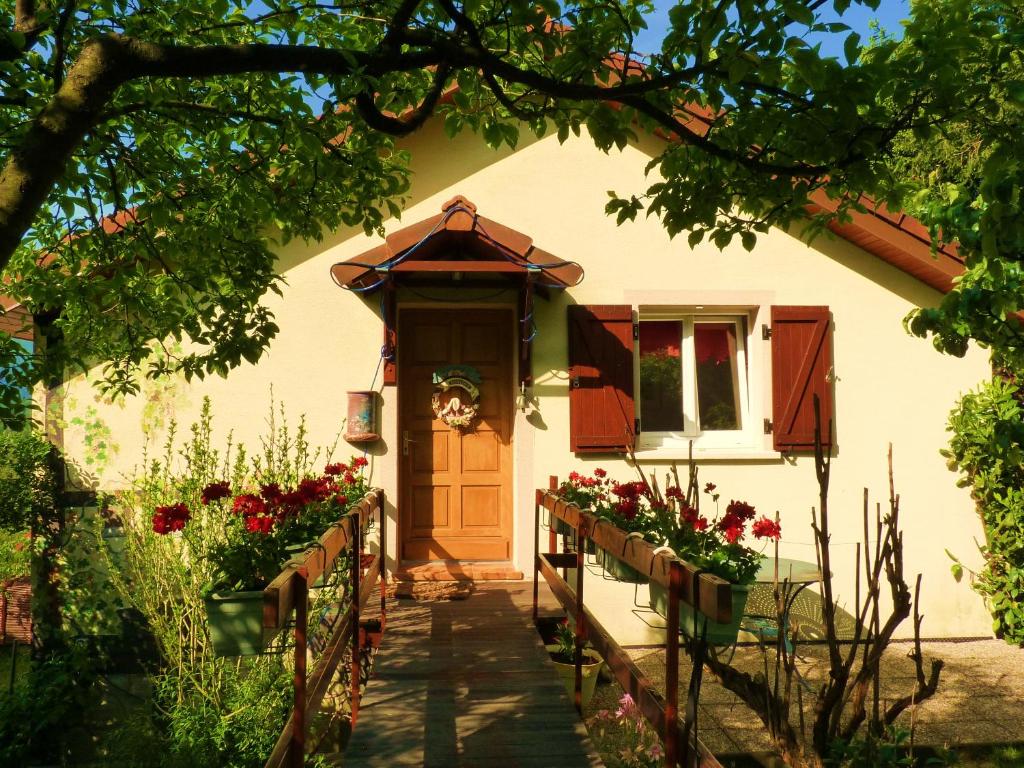 a house with flowers in front of it at Le Chalet Bel Air in Oderen