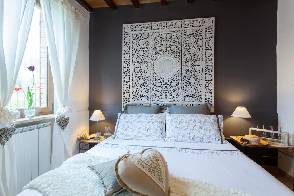 Postel nebo postele na pokoji v ubytování Le case di Lisetta Holiday homes