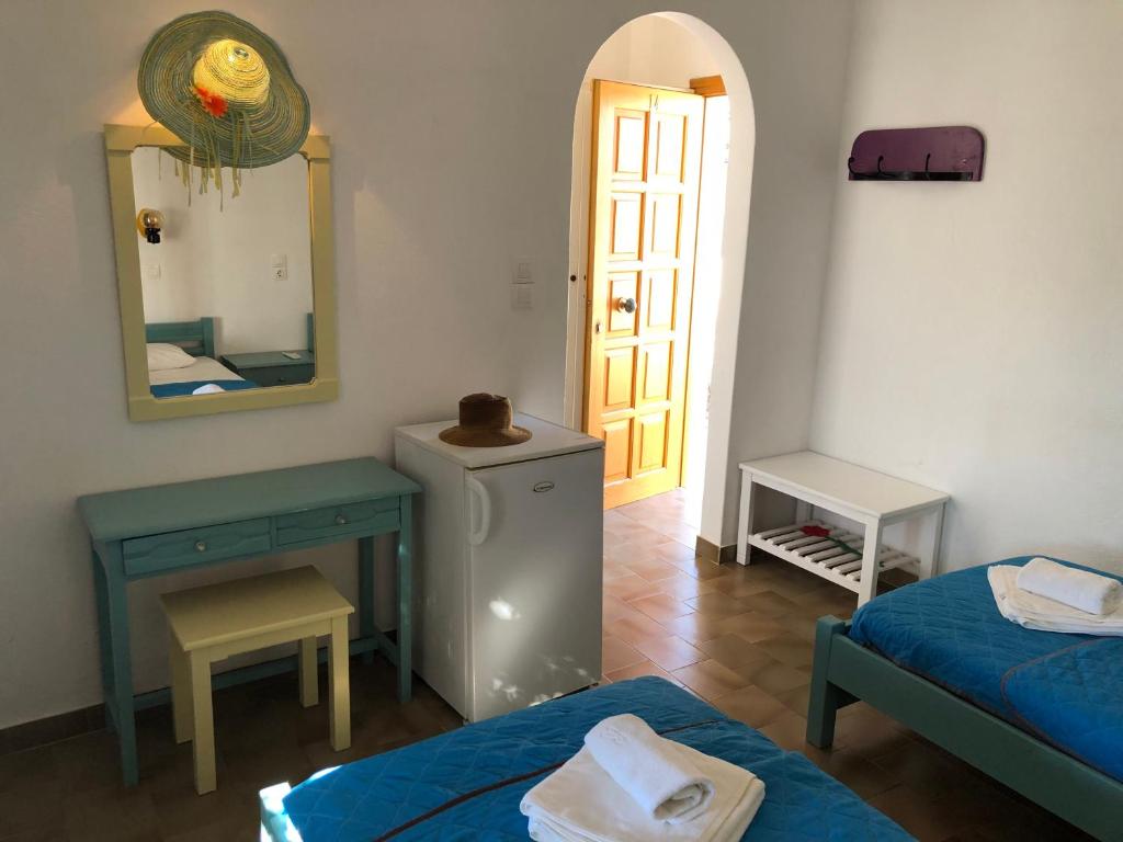 Postel nebo postele na pokoji v ubytování Arokaria Seaside