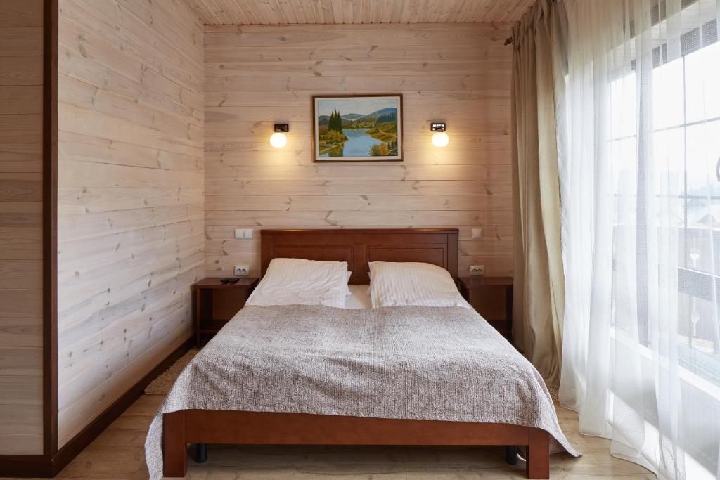 Postel nebo postele na pokoji v ubytování Zlata