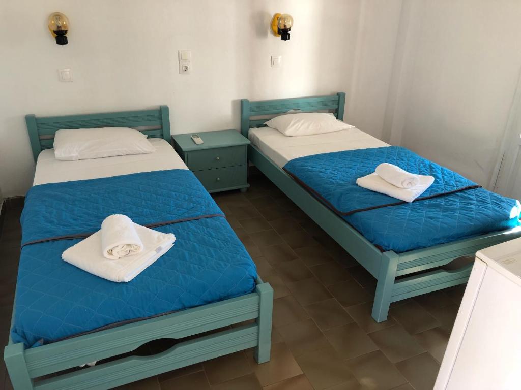 Postel nebo postele na pokoji v ubytování Arokaria Seaside