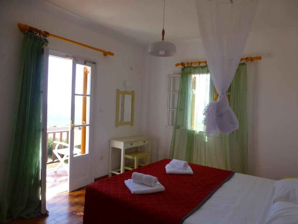 Postel nebo postele na pokoji v ubytování Arokaria Seaside