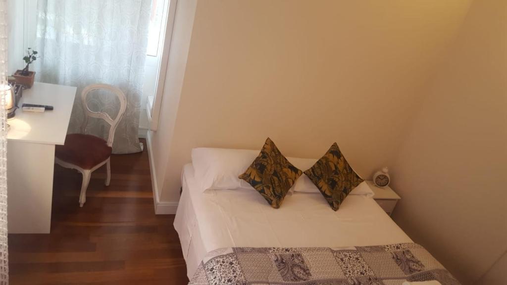Posteľ alebo postele v izbe v ubytovaní Dreaming Piazza Bra Rooms