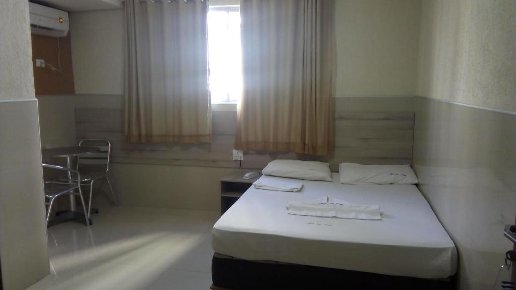 Cama ou camas em um quarto em Hotel Uzi Praia