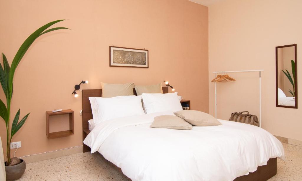 Łóżko lub łóżka w pokoju w obiekcie B&B Syrentum