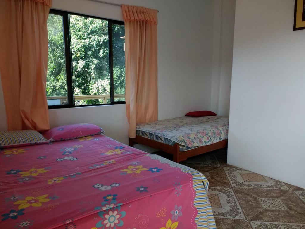Postel nebo postele na pokoji v ubytování Hospedaje Costa Norte