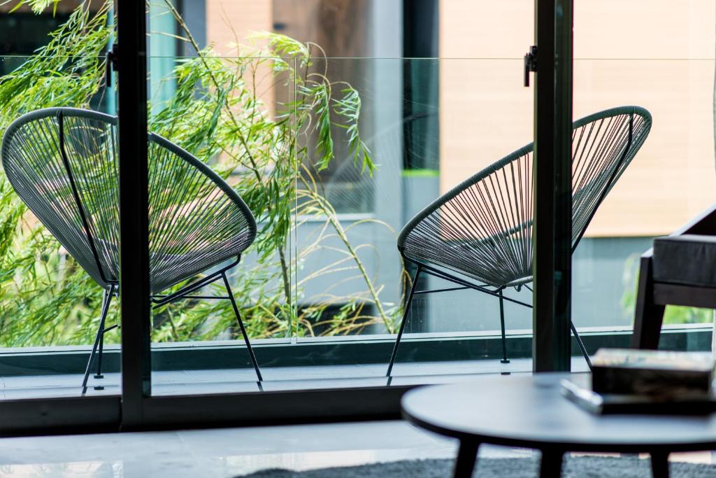 Um jardim no exterior de Glam Habitat - SHA Extra Plus