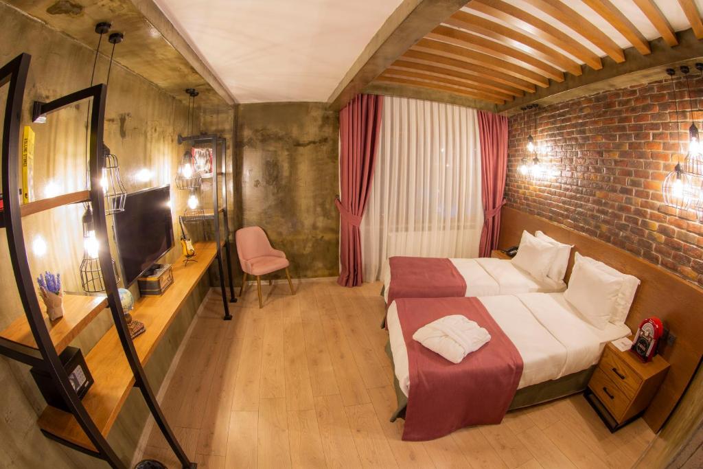 Postel nebo postele na pokoji v ubytování Meydan Besiktas Hotel