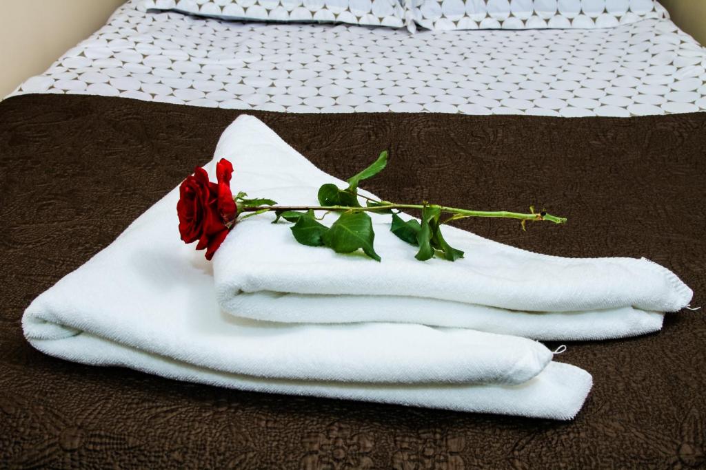 Postel nebo postele na pokoji v ubytování MGA Hostel & Tours