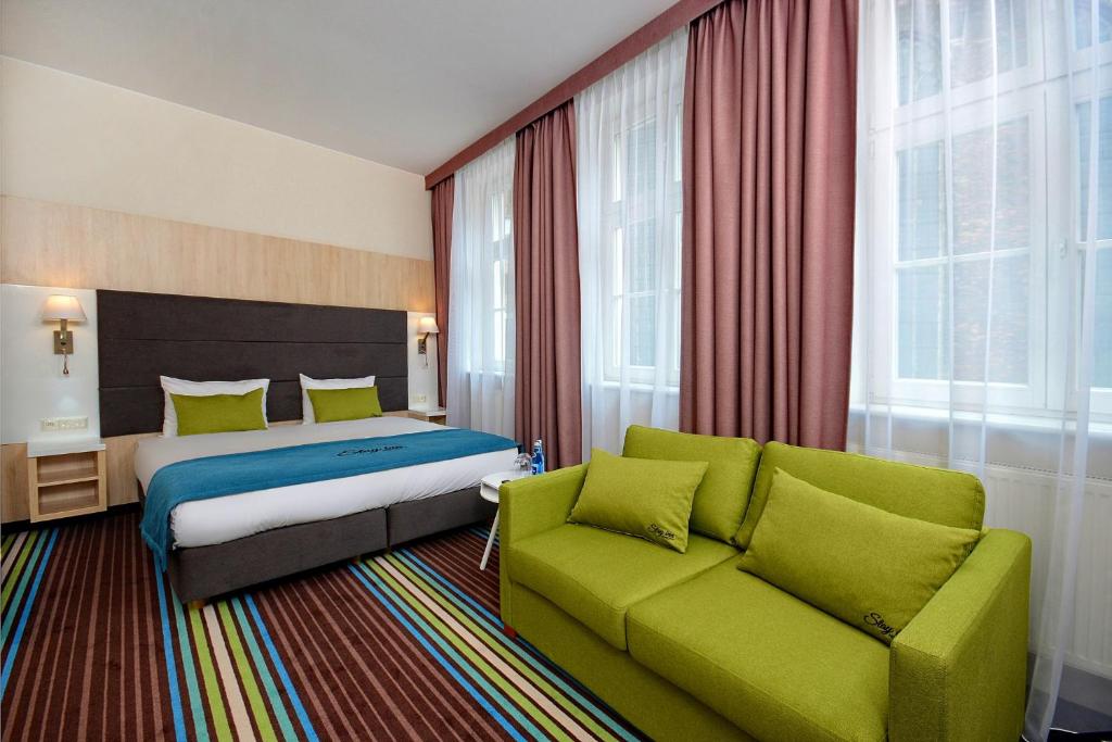 Łóżko lub łóżka w pokoju w obiekcie Stay inn Hotel Gdańsk