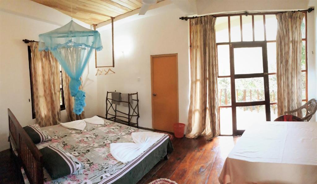 Postel nebo postele na pokoji v ubytování Seasons Four Mini Jungle Cabana