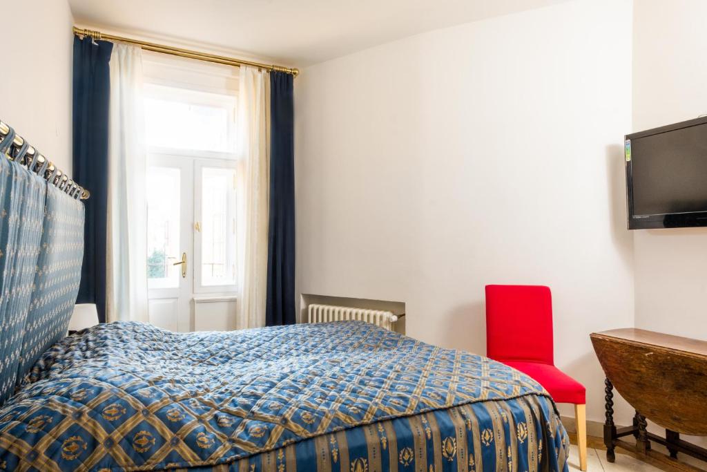 Łóżko lub łóżka w pokoju w obiekcie La Fenice